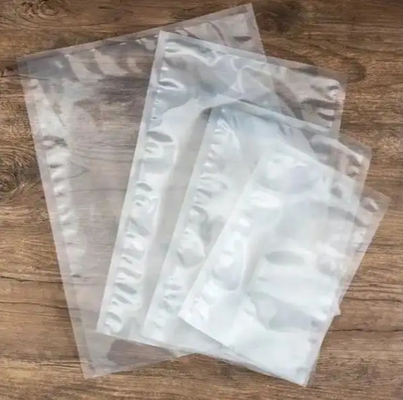 Pour conserver les aliments frais Sacs à vide étanches à la nourriture Sacs à vide étanches à la nourriture Sacs et rouleaux de film pompage à sec et sacs transparents imperméables à l'humidité