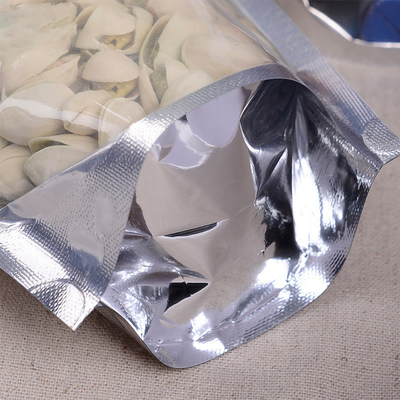 Position zip-lock de papier d'aluminium vers le haut des poches rescellables avec l'avant transparent