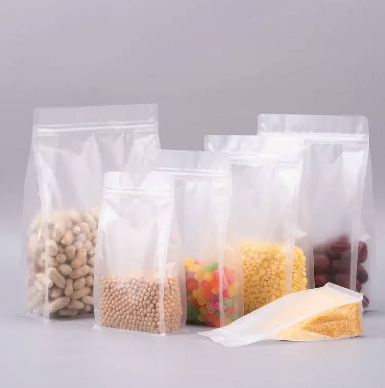 Confectionnement à l'échelle de la marque Flat Bottom Eight Side Seal Clear Transparent Zip Lock Fruits secs Alimentation Rizière Emballage en plastique Poche debout